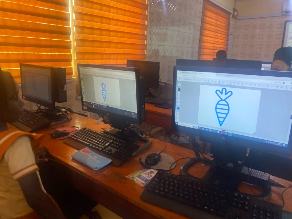 Students drawing in a computer lab during a Coasted Code session